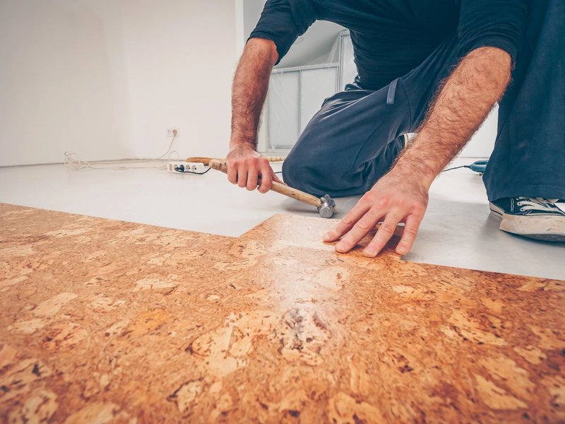 Person installing Cork flooring from Brosious Carpet and Floors Inc in Missoula, MT