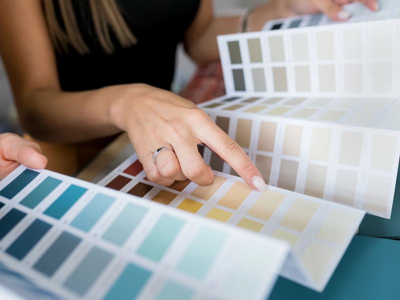Person choosing from color swatches from Brosious Carpet and Floors Inc in Missoula, MT