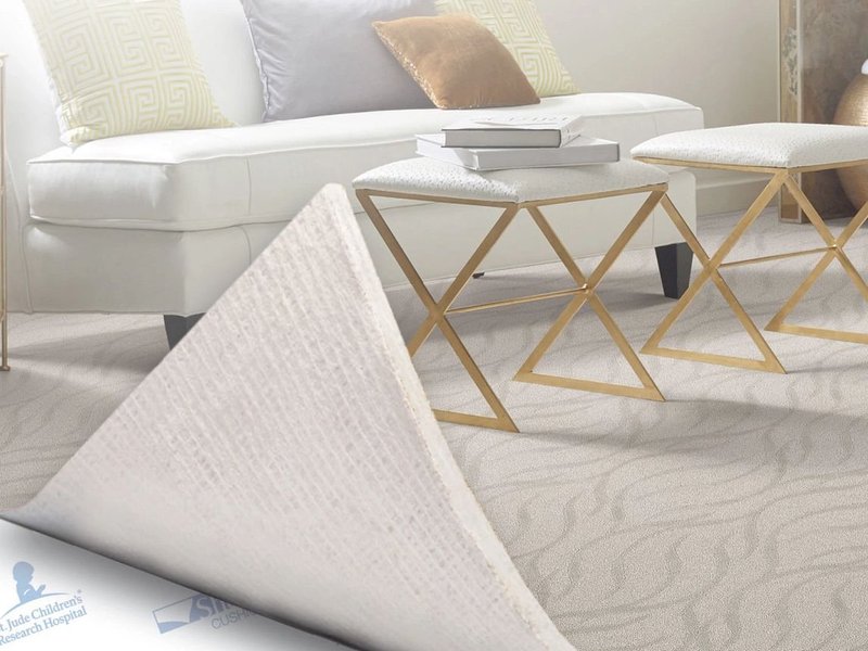 Carpet being peeled back to reveal carpet cushion beneath - Brosious Carpet and Floors Inc in Missoula, MT